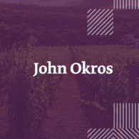Джон Окрос